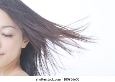 Japanese Woman's Hair Blown Away By The Wind