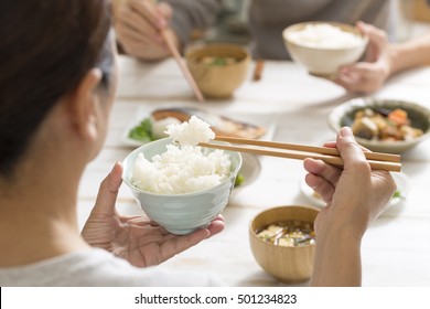 Japanese women eat rice - Powered by Shutterstock