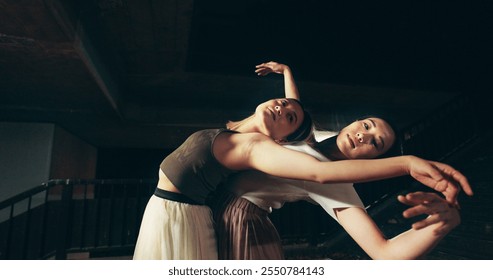 Japanese women, outdoor and contemporary dance at night for practice, training and choreography. Female people, technique and rehearsal as professional dancer for grace, theater and performance art - Powered by Shutterstock