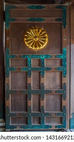 Japanese Wooden Door With A Gold Chrysanthemum Crest 