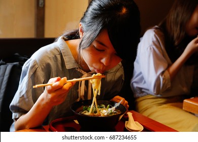 Japanese Young Woman Eating Curry Udon