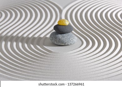 Japanese ZEN garden with stacked stones in sand