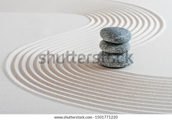 Japanese ZEN garden with\
stone in sand