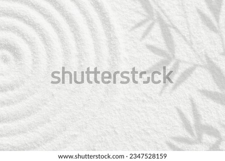 Japanese Zen Garden white sand surface with bamboo leaf shadow on circles,Sand texture with palm leaves shadow on spiritual pattern,Harmony,Meditation,Zen like concept	
