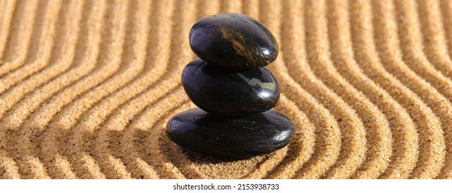 Japanese Zen Garden With Yin Yang Stone In Textured Sand