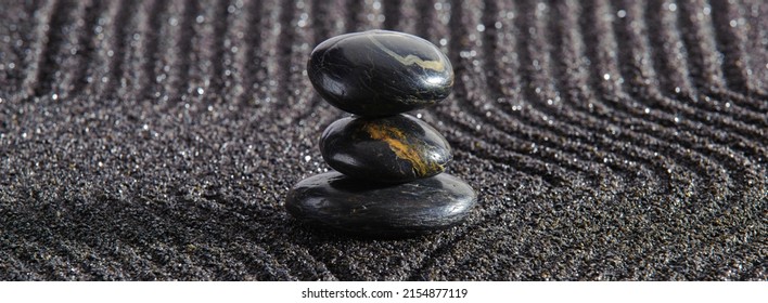 Japanese Zen Garden With Yin Yang Stone In Textured Sand