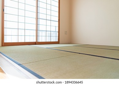 Japanese-style room with shoji and tatami mats in the afternoon
