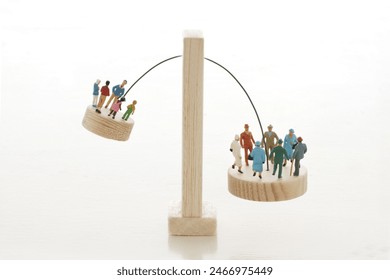 Japan's social problems using a seesaw to represent the declining birthrate and aging population