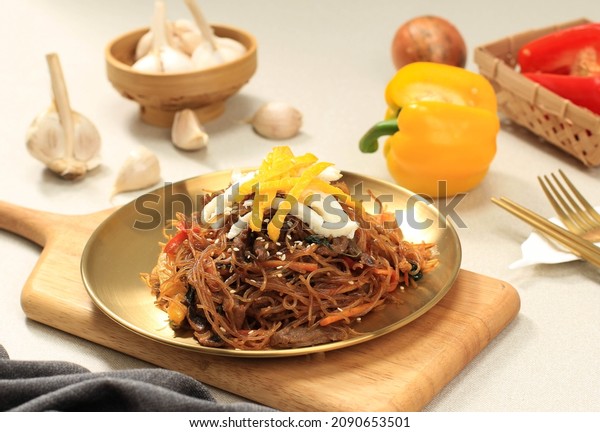 Japchae Korean Cuisine Glass Chapchae Noodles Dish with\
Vegetables and Meat. Asian Traditional Food, Korean Authentic Meal.\
