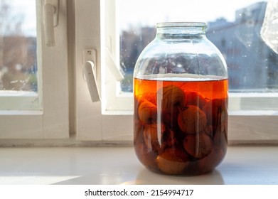 jar of apple compote on the windowsill