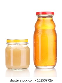 Jar of baby puree and juice isolated on white