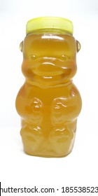 A jar of bee honey, in the shape of a bear