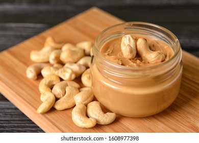 Jar of cashew butter on wooden table