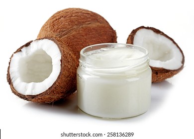 Jar Of Coconut Oil And Fresh Coconuts Isolated On White