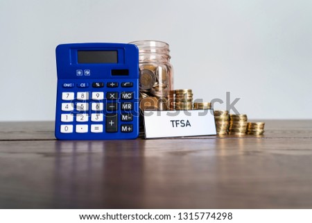 Jar of Coins with calculator showing savings to a Tax Free Savings Account
