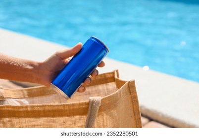 A jar with a cold drink in a hand against the background of a summer pool. Relax by the pool at the hotel. - Powered by Shutterstock