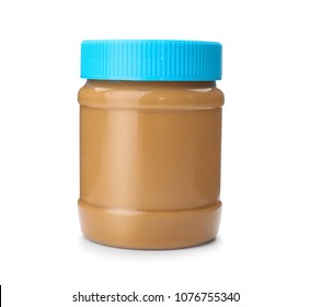 Jar with creamy peanut butter on white background