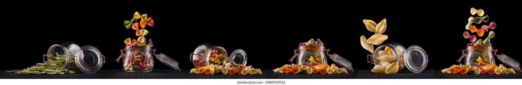 Jar of different type of pasta isolated on black background.