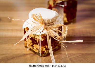 Jar Of Dried Fruit And Honey Mix On The Table. Layered Dried Fruits Mix With Honey Topping. 