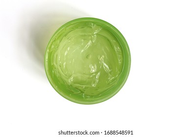 A Jar Of Fresh Aloe Vera Gel Isolated On White Background.A Aloe Vera Is Natural Remedy For Sunburn Relief And Nourishing The Skin.