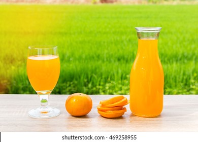 Jar Glasses Of Orange Juice And Fruits