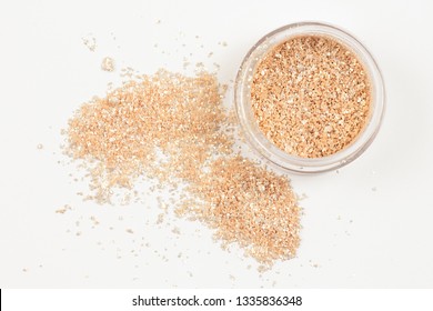 Jar With Gold Glossy Eye Shadow On White Background. Isolated. Top View.