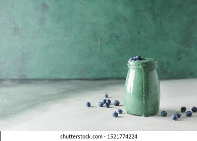 Jar Of Healthy Spirulina Smoothie On Table