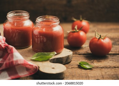 Jar Of Home Made Classic Tomato Sauce On Wooden Table Close Up