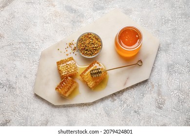 Jar Of Honey, Combs And Bee Pollen On Light Background