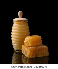 Jar Of Honey And Fresh Combs On Dark Background