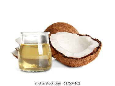 Jar with melted coconut oil and nut on white background - Shutterstock ID 617534102