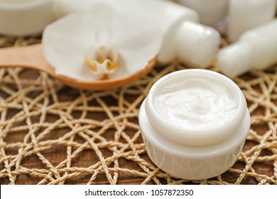 Jar Of Moisturizing Cream On Wooden Background