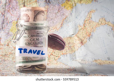 jar with money on used map. holiday savings