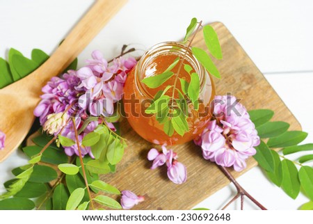 Similar – Cup with acacia blossoms Tea with spoon and honey