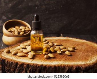 jar of oil almond, black stone on the table for a spa, selective focus, space for text