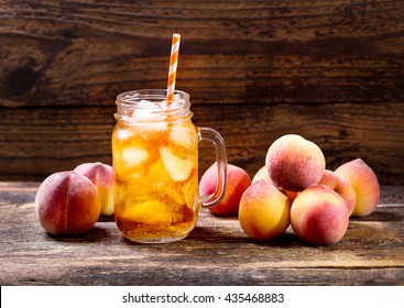 jar of peach iced tea with fresh fruit