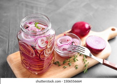 Jar Of Pickled Onions On Grey Table