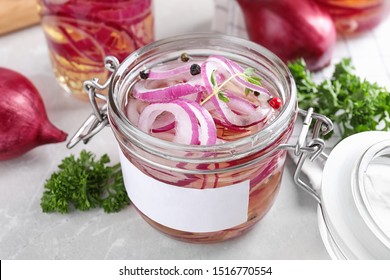 Jar Of Pickled Onions On Marble Table