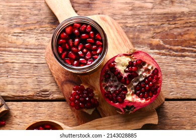 Jar Of Pomegranate Molasses On Wooden Background