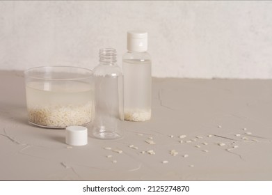 Jar Of Rice Water For Skin Care Face Cleansing Cosmetic Product. Holistic Beauty Concept, Fermented Beauty Care Trend. Copy Space