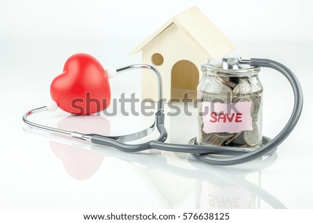 Jar of saving coin and stethoscope