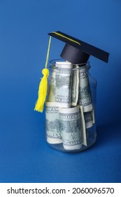 Jar With Savings For Education And Graduation Hat On Color Background