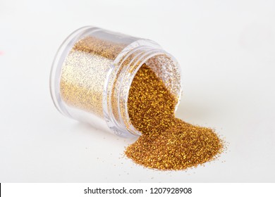 Jar With Spilled Gold Glitter, Shiny Eyeshadows. 