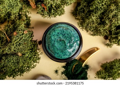 Jar Of Spirulina Facial Mask On Color Background