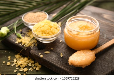 Jar With Sugar Scrub On Wooden Board