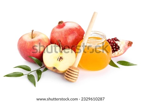 Jar of sweet honey, ripe pomegranate, apples and plant leaves on white background. Rosh hashanah (Jewish New Year) celebration Foto stock © 