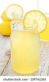 Jar Of Tasty Fresh Lemonade With Lemons In Background