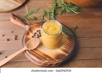 Jar Of Tasty Honey Mustard Sauce On Wooden Table