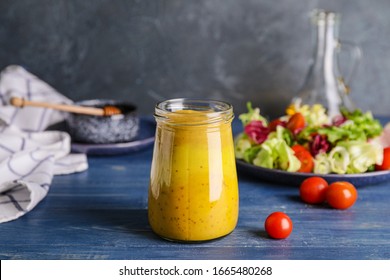 Jar Of Tasty Honey Mustard Sauce On Wooden Table