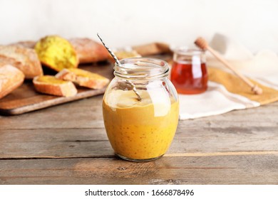 Jar Of Tasty Honey Mustard Sauce On Wooden Table